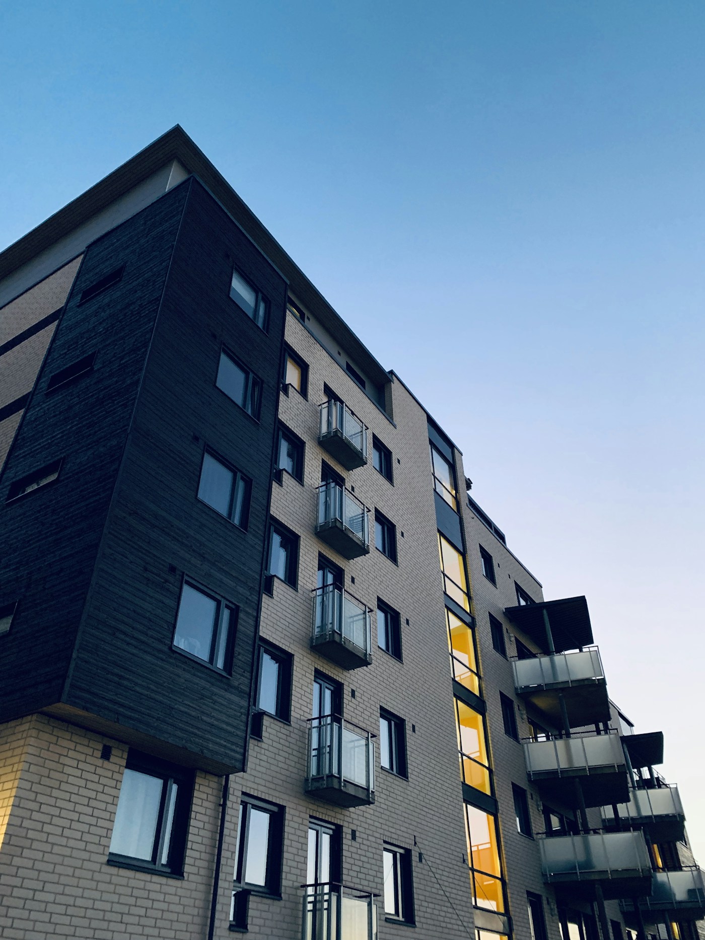 Modern apartment building at dusk — Australia's rental vacancy crisis